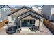 Covered patio area perfect for outdoor dining, with views of the fenced backyard at 915 N Waterloo Ct, Aurora, CO 80018