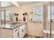 Bathroom with granite countertop, double sinks, and shower at 9308 Inca Dove Cir, Littleton, CO 80125