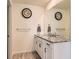 Bathroom with granite countertop double vanity and large mirror at 9308 Inca Dove Cir, Littleton, CO 80125