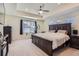 Spacious main bedroom with carpeted floor and large windows at 9308 Inca Dove Cir, Littleton, CO 80125