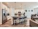 Modern kitchen with granite countertops, stainless steel appliances, and an island with seating at 9308 Inca Dove Cir, Littleton, CO 80125