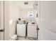 Laundry room with washer, dryer, and shelving at 9308 Inca Dove Cir, Littleton, CO 80125