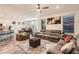 Open concept living room with kitchen, sectional sofa and a fireplace at 9308 Inca Dove Cir, Littleton, CO 80125