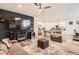 Open concept living room with kitchen, sectional sofa and a fireplace at 9308 Inca Dove Cir, Littleton, CO 80125