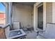 Covered patio with fire pit and seating at 9308 Inca Dove Cir, Littleton, CO 80125