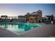Evening view of community pool and clubhouse at 9308 Inca Dove Cir, Littleton, CO 80125