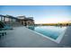 Community pool with lounge chairs and adjacent clubhouse at 9308 Inca Dove Cir, Littleton, CO 80125