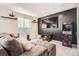 Recreation room with a large TV and arcade game at 9308 Inca Dove Cir, Littleton, CO 80125