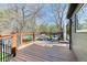 Enjoy outdoor living on this spacious deck with wood railing, outdoor seating, and a hot tub at 13830 Silverton Dr, Broomfield, CO 80020