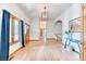 Inviting foyer with wood floors, natural light, and a welcoming atmosphere, enhancing the home's entry at 13830 Silverton Dr, Broomfield, CO 80020