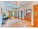 Welcoming foyer with hardwood floors, natural light, and an open layout, enhancing the home's appeal at 13830 Silverton Dr, Broomfield, CO 80020