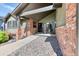 Welcoming front entrance with brick columns, a cozy bench, and a well-maintained walkway at 13830 Silverton Dr, Broomfield, CO 80020