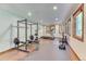 Bright home gym equipped with weight training equipment and a treadmill, offering a convenient fitness space at 13830 Silverton Dr, Broomfield, CO 80020