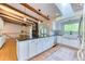 Bright, open kitchen featuring an island with granite countertop, and modern appliances at 13830 Silverton Dr, Broomfield, CO 80020