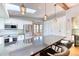 Beautiful kitchen with a large island, stainless steel appliances, skylight, and a charming window seat at 13830 Silverton Dr, Broomfield, CO 80020