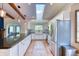 Spacious kitchen with granite countertops, stainless steel appliances, and a sunny window over the sink at 13830 Silverton Dr, Broomfield, CO 80020