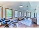 Inviting living room featuring natural light, stylish seating, and a calming view of the outdoors at 13830 Silverton Dr, Broomfield, CO 80020