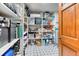 Walk-in pantry with abundant storage and shelving, providing organized space for kitchen and household items at 13830 Silverton Dr, Broomfield, CO 80020
