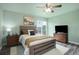 Comfortable bedroom featuring a ceiling fan and neutral decor at 10510 Inspiration Dr, Parker, CO 80138