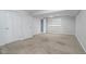 Bedroom featuring neutral carpet, built-in shelving, and two closet doors at 10510 Inspiration Dr, Parker, CO 80138