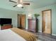 Cozy bedroom with a ceiling fan, closet, and attached bathroom at 10510 Inspiration Dr, Parker, CO 80138
