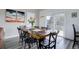 Elegant dining room with a rustic wooden table and stylish decor at 10510 Inspiration Dr, Parker, CO 80138