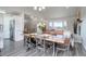 Cozy dining room with wood table, plenty of room for entertaining at 10510 Inspiration Dr, Parker, CO 80138