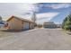 Long driveway leading to a detached two-bay garage, providing ample parking at 10510 Inspiration Dr, Parker, CO 80138