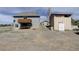 Rear exterior view of the house with a deck and ample space to build at 10510 Inspiration Dr, Parker, CO 80138