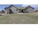 Exterior view of home featuring a backyard and sliding glass door at 10510 Inspiration Dr, Parker, CO 80138