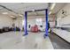 Large garage featuring auto lifts, work benches, and storage cabinets at 10510 Inspiration Dr, Parker, CO 80138