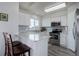 Eat-in kitchen featuring granite countertops, a breakfast bar, and stainless steel appliances at 10510 Inspiration Dr, Parker, CO 80138