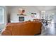 Bright living room featuring a fireplace, vaulted ceilings, and ample seating at 10510 Inspiration Dr, Parker, CO 80138