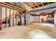 Unfinished basement with exposed beams and utilities; ample potential for customization at 1978 Granger Cir, Castle Rock, CO 80109