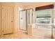 Well appointed bathroom with soaking tub, shower, and tile flooring at 1978 Granger Cir, Castle Rock, CO 80109