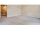 Comfortable bedroom with plush carpet and access to adjacent rooms at 1978 Granger Cir, Castle Rock, CO 80109