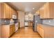 Spacious kitchen featuring stainless steel appliances, tile backsplash, and hardwood flooring at 1978 Granger Cir, Castle Rock, CO 80109