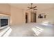 Open-concept living room with a fireplace, neutral walls, and views of the kitchen at 1978 Granger Cir, Castle Rock, CO 80109