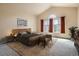 Vaulted main bedroom with a large window and plush carpeting at 1978 Granger Cir, Castle Rock, CO 80109