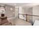 Cozy loft area with carpet flooring, overlooking the staircase at 7777 E 23Rd Ave # 1406, Denver, CO 80238