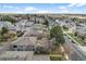 Neighborhood aerial showcasing gray townhomes with well-kept lawns and tree-lined streets on a clear day at 1280 Sable Blvd, Aurora, CO 80011