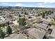 Scenic aerial view of neighborhood featuring well-maintained homes and lush greenery against a city backdrop at 1280 Sable Blvd, Aurora, CO 80011