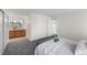 This bedroom features neutral carpet, natural light, and ensuite bathroom at 1280 Sable Blvd, Aurora, CO 80011