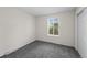 This bedroom features neutral carpet, natural light, and closet at 1280 Sable Blvd, Aurora, CO 80011