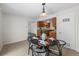 Cozy dining area with stylish decor, set for an intimate meal, next to the kitchen at 1280 Sable Blvd, Aurora, CO 80011