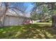 Well-maintained home with mature trees and green grass at 1280 Sable Blvd, Aurora, CO 80011