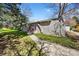 Charming home with sidewalk leading to front door, and mature trees at 1280 Sable Blvd, Aurora, CO 80011