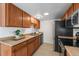 Well-maintained kitchen boasting modern appliances and beautiful wood cabinetry at 1280 Sable Blvd, Aurora, CO 80011