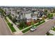 Expansive aerial view reveals a modern home with solar panels, fenced yard, and stylish patio in a vibrant neighborhood at 9391 E 59Th North Pl, Denver, CO 80238