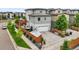 Aerial view of home showcasing the backyard with hot tub, deck, and privacy fence at 9391 E 59Th North Pl, Denver, CO 80238